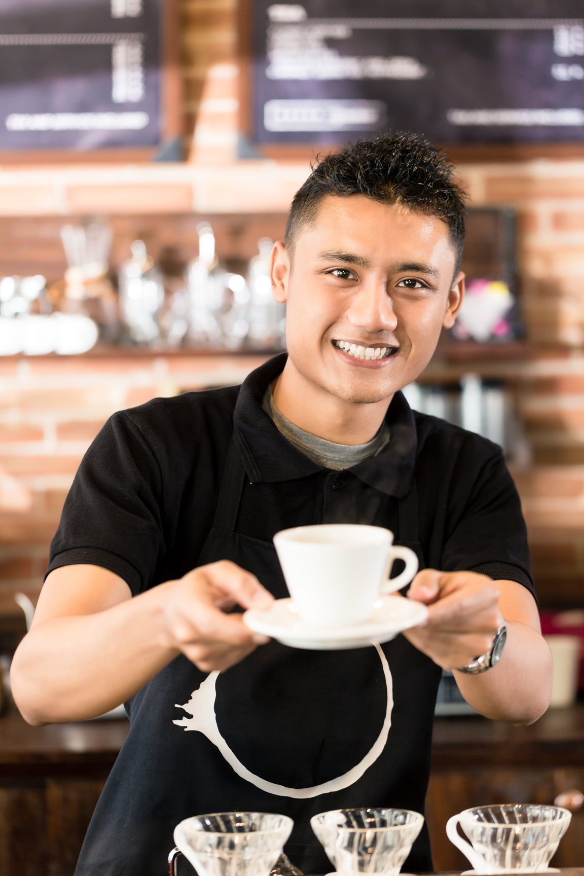 Asian Barista Offering Coffee